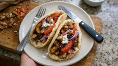 Greek-Style Chicken Gyros: juicy yoghurt-marinated thighs, grilled and carved into warm pittas