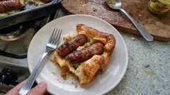 Crisp, risen toad-in-the-hole with chipolatas – the hot-tin method that works